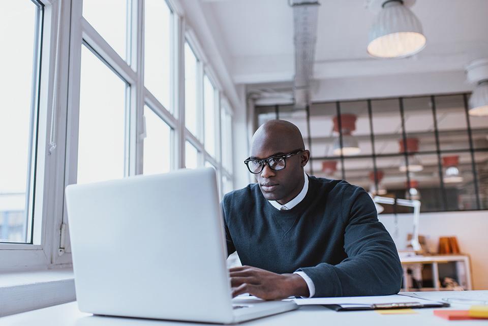 MBA Student studying at a computer